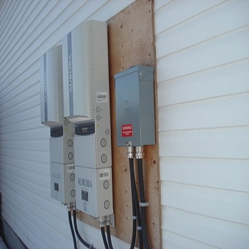 Dual solar inverters with electrical conduit installation.