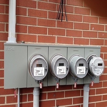 Exterior four-meter electrical service panel.