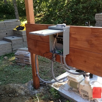 Outdoor electrical control box installation.
