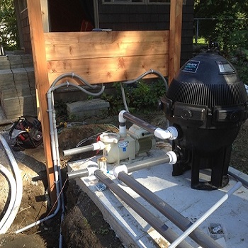 Pool pump and filtration plumbing and electrical setup.